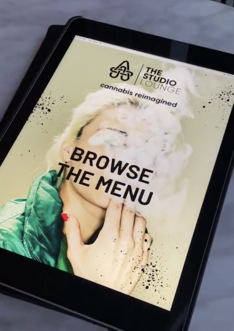 cannabis consumption lounge technology - self ordering tablet placed on table